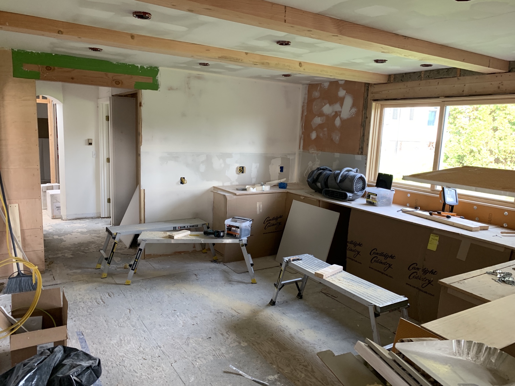 kitchen with subfloor and bare walls showing