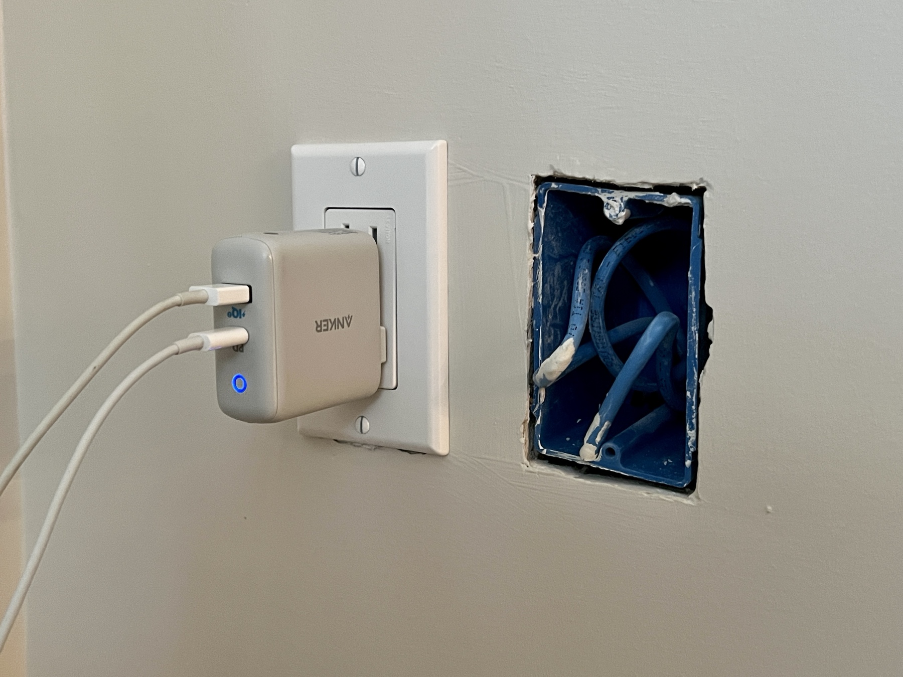 power receptacle with USB charger at left and partially installed ethernet port at right